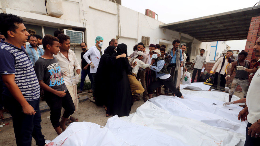 Bodies outside a hospital morge after an air strike hit a fish market in Hodeida