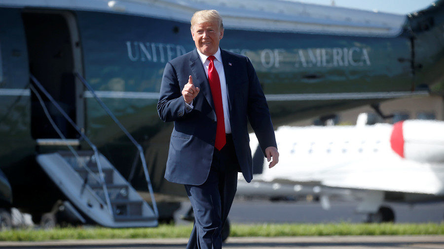 Trump pointing at sky