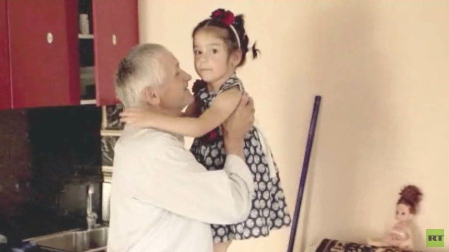 Click to enlarge Fatima and her grandfather Anwar in Russia's Makhachkala.