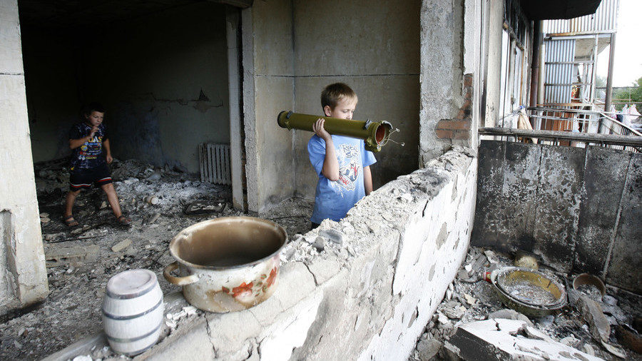 Click to enlarge Children play with an empty grenade launcher