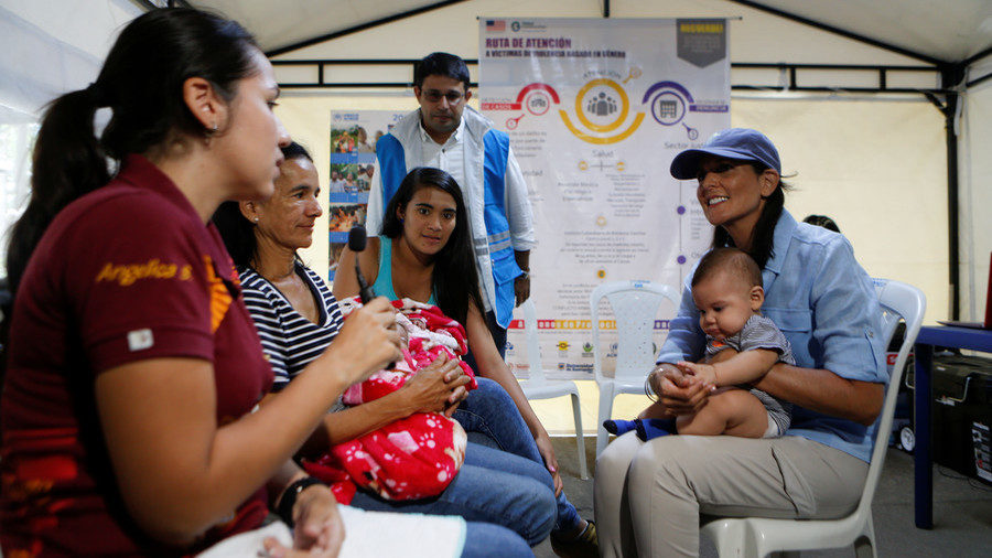 Click to enlarge Nikki Haley with Venezuelan migrants