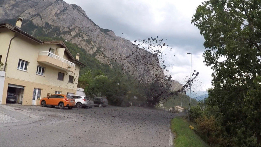 Rampaging mudslides wreak havoc in village in Swiss Alps (