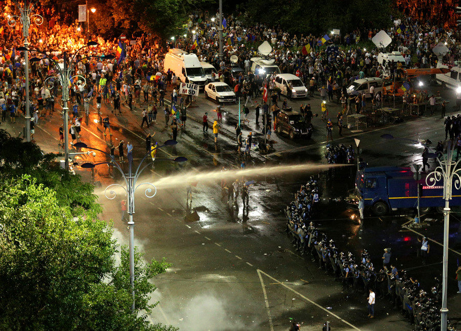 Police uses a water cannon against an anti-government rally in Bucharest