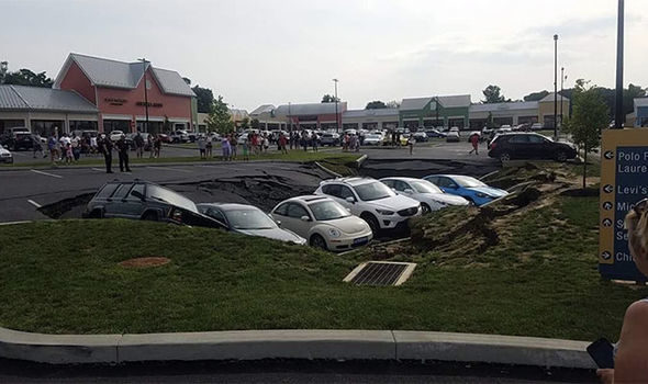 Click to enlarge Measuring half of the width of the H&M shop, the sinkhole trapped the cars
