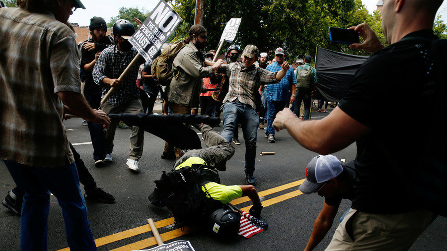 White nationalist protesters clash with counter-protesters in Charlottesville on August 12, 2017.