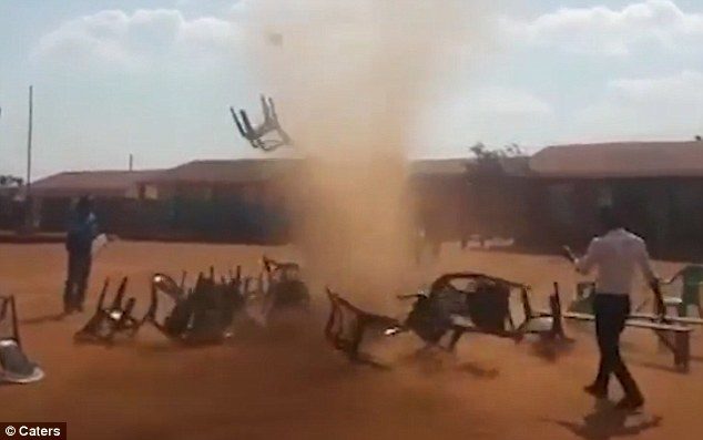 The footage shows the massive whirlwind-shaped cloud ripping up an area where plastic chairs were lined causing them to swirl around in the air