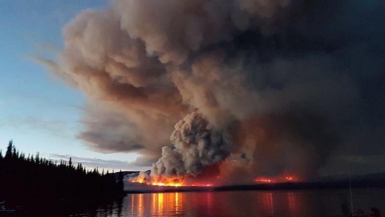Click to enlarge A wildfire burns on Eutsuk Lake in North Tweedsmuir Park south of Houston.