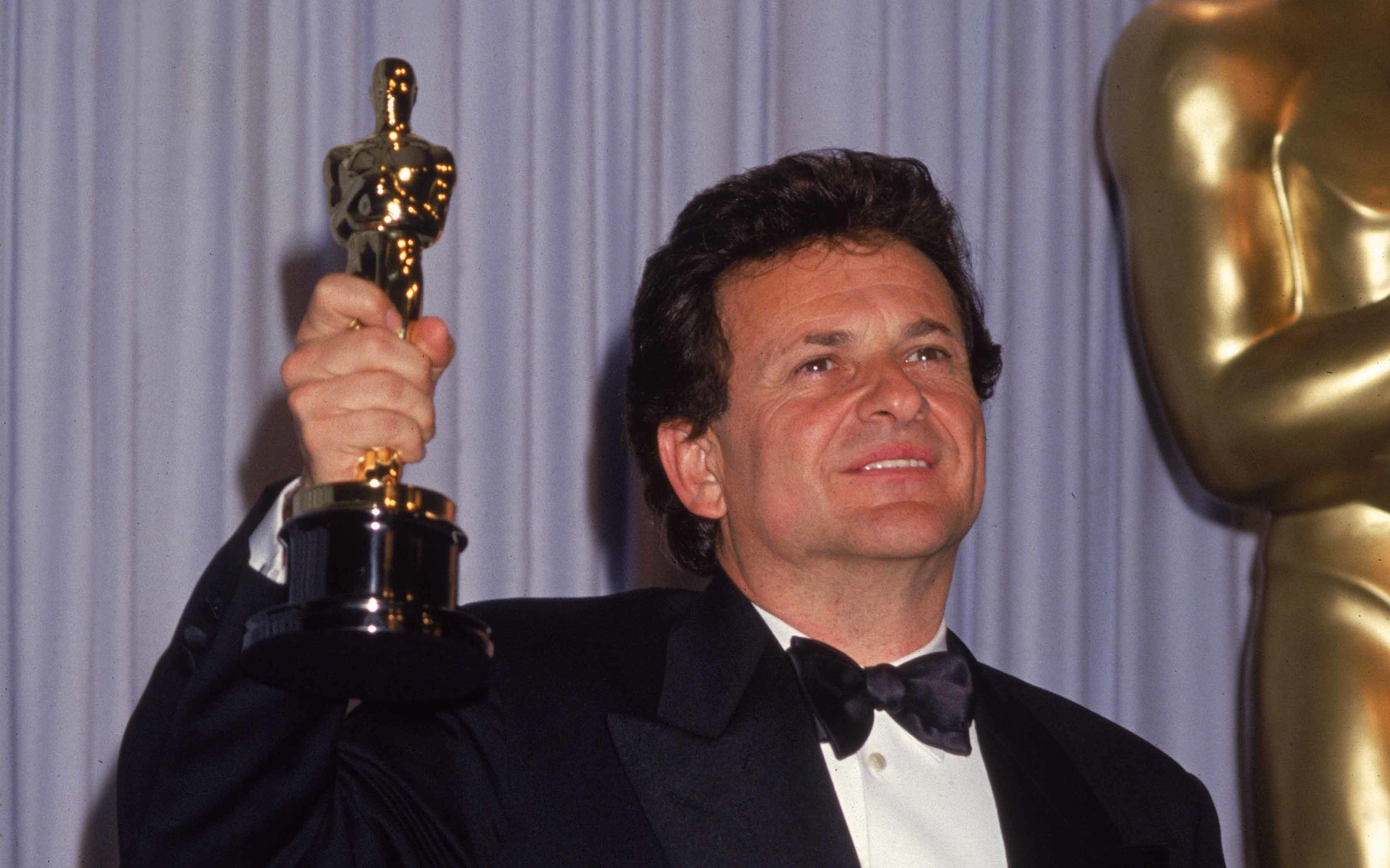 American actor Joe Pesci smiles as he holds up his Oscar for Best Supporting Actor for his role in 'Goodfellas.'