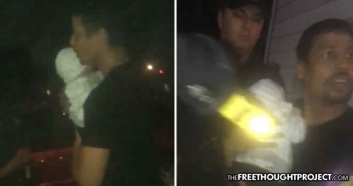 Cops taser man with baby