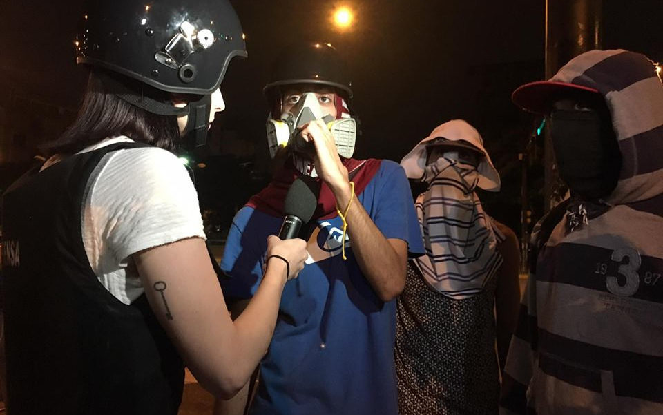 Journalist Abby Martin interviews Venezuelan opposition protesters.
