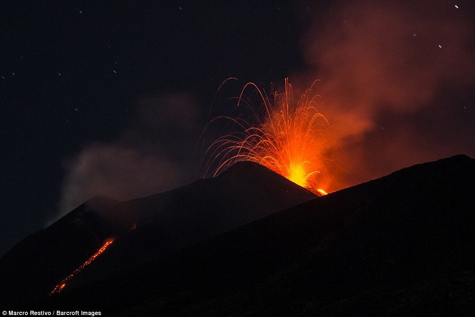 Mount Etna in Sicily has roared back into spectacular volcanic action, sending up plumes of ash and spewing lava as high as 500 feet into the air