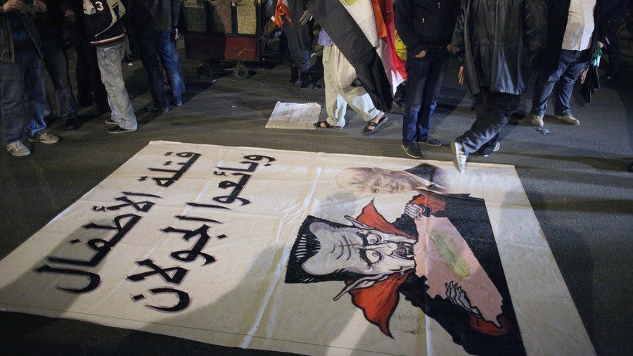 Click to enlarge A caricature of Syrian President Bashar Assad