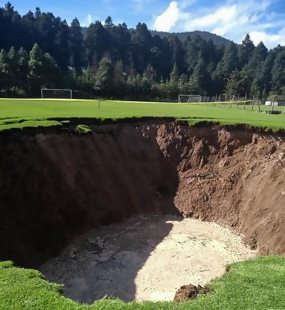 A massive sinkhole suddenly formed at a Mexican football pitch