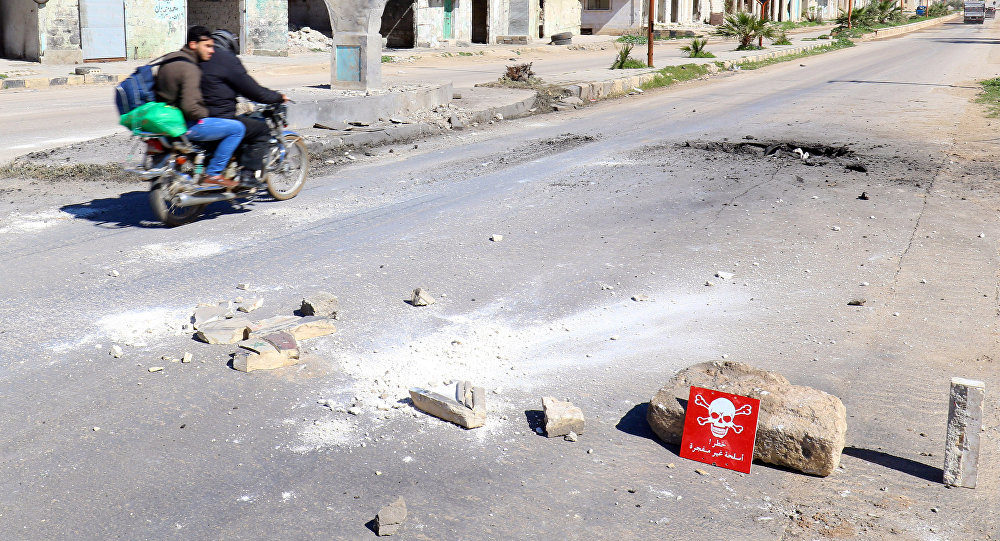 Click to enlarge Men motorbike morter shell Idlib