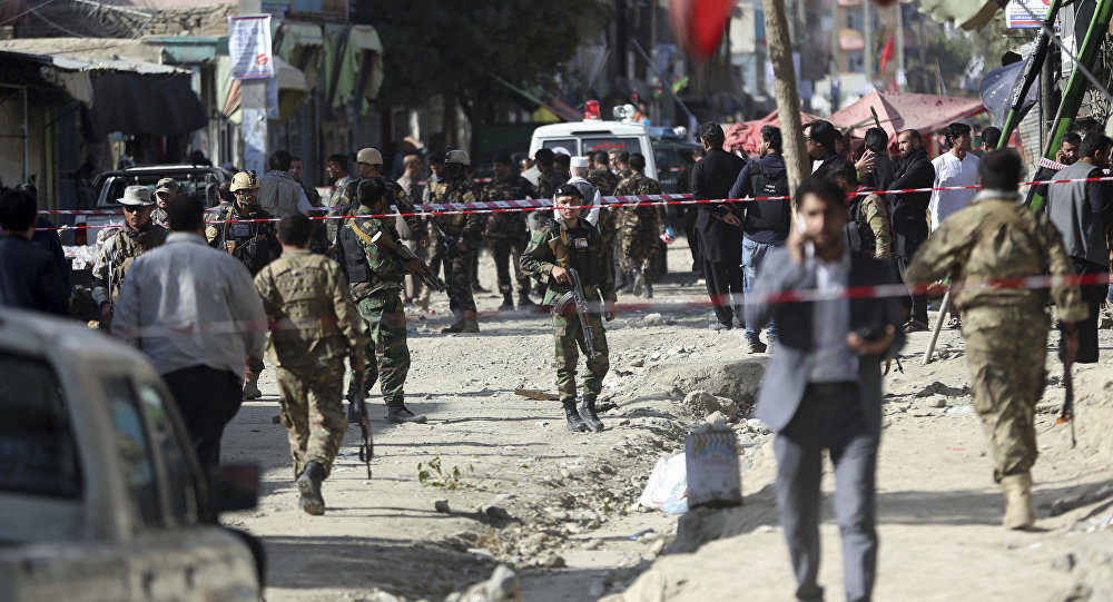 Click to enlarge Security forces inspect the site of a suicide attack