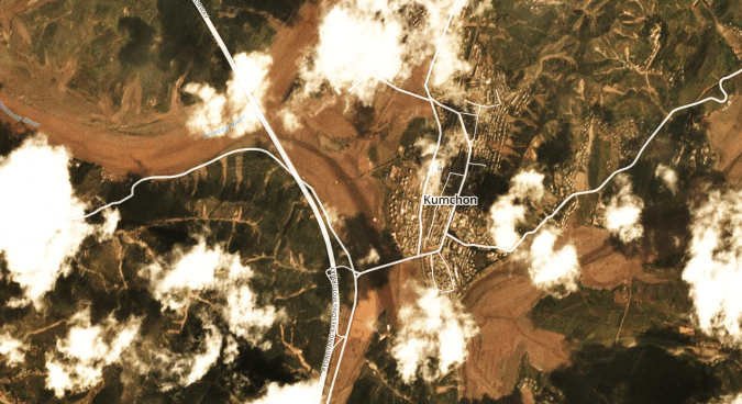 Flooding is evident across the town of Kumchon. Water levels have risen along the Ryesong River