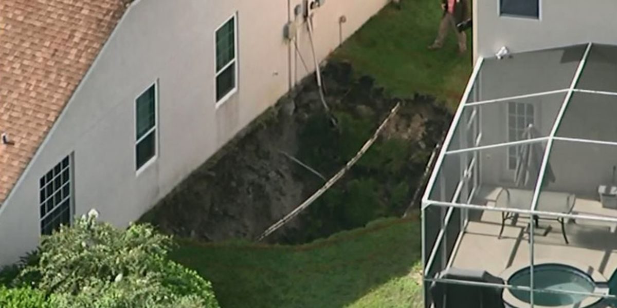 The sinkhole opened between the two houses and is 20 feet deep and 40 feet wide.