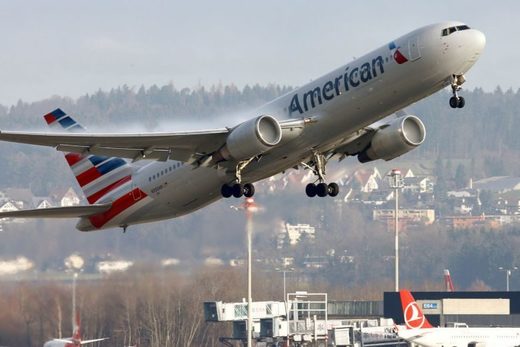 Click to enlarge An American Airlines aircraft taking off