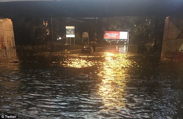 Flash flooding occurred across the city. Pictured: flooding near Sydney Airport