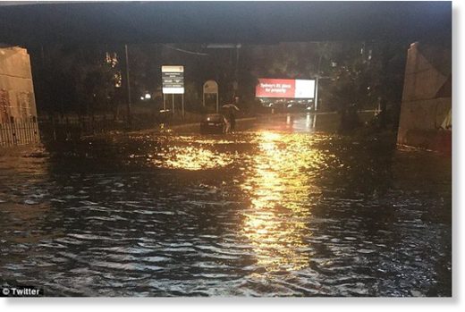 Flash flooding occurred across the city. Pictured: flooding near Sydney Airport