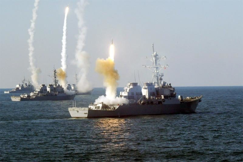 Click to enlarge US ships firing Tomahawk missiles
