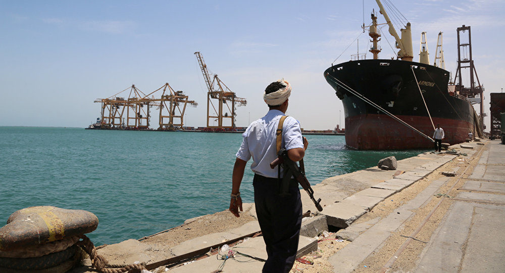 Click to enlarge A soldier walks at Red Sea port of Hodeidah