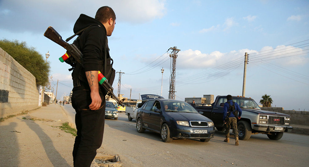 Click to enlarge YPG gunman