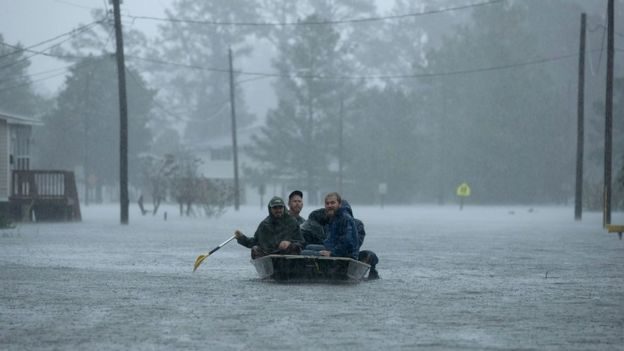Volunteers are helping to rescue residents from flooded homes