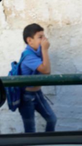 Schoolboy running from tear gas, Abu Dis East Jerusalem
