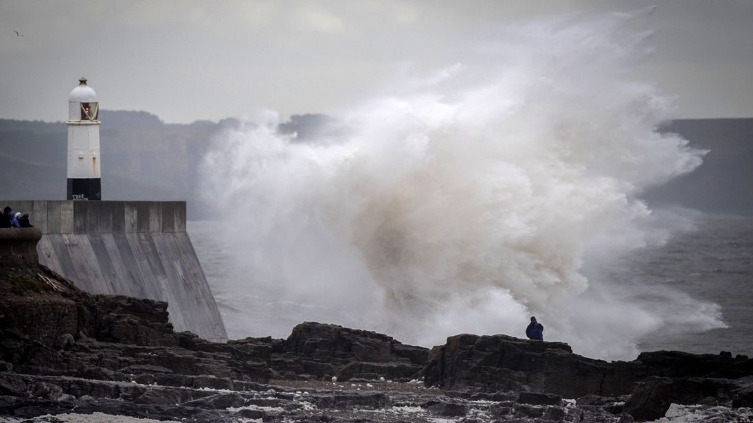 Click to enlarge Waves hit the seafront in Porthcawl, Wales