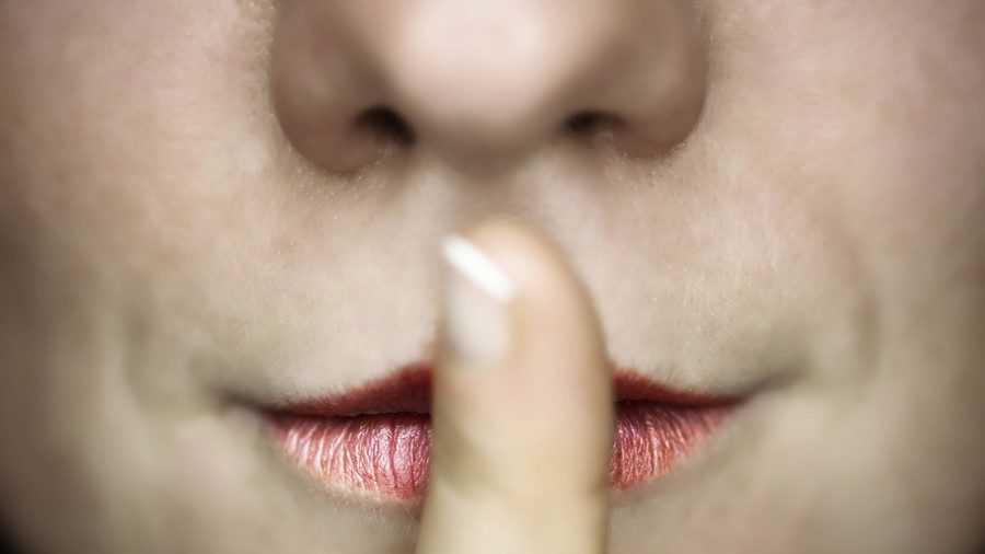 Click to enlarge woman shushing secret censorship