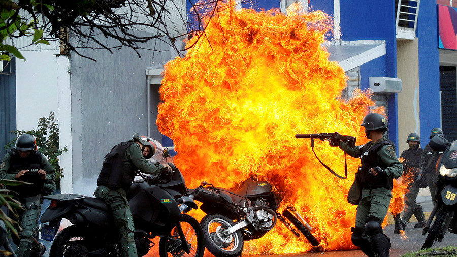 Riot security forces clash with anti-government demonstrators in San Cristobal, Venezuela