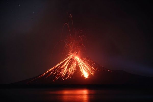 Click to enlarge An Indonesian volcano called Anak Krakatau, known as the ‘child’ of the legendary Krakatoa, erupted on July 19, 2018, spewing a plume of ash high into the sky as molten lava streamed down from its summit. (Ferdi Awed