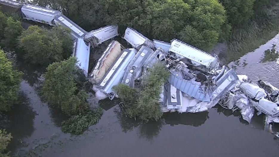 Iowa freight train derailment sends rail cars plunging into river