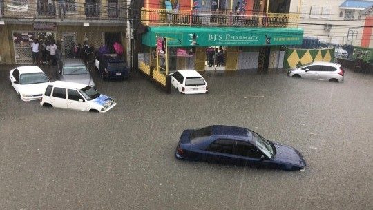 Click to enlarge Heavy rains flooded sections of May Pen Clarendon on Monday