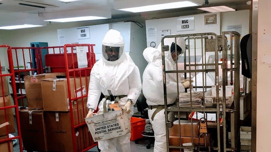Defense Department personnel in protective suits
