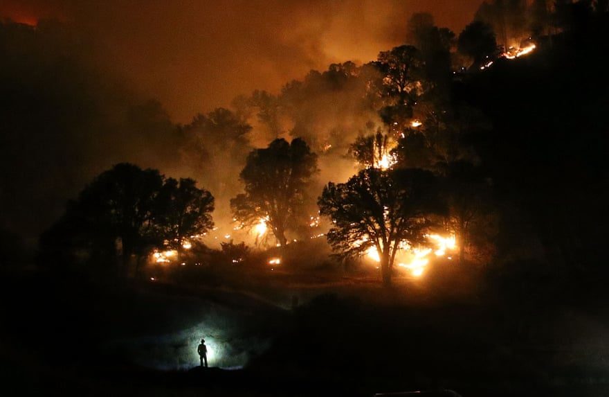 A firefighter monitors a backfire near Clearlake, California. The Rocky Fire burned over 60,000 acres and forced the evacuation of 12,000 residents