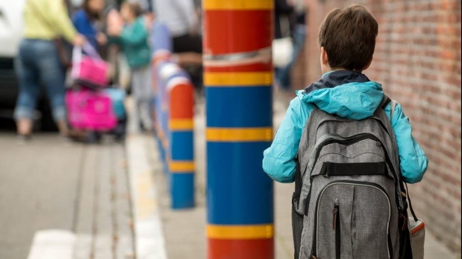 school child with backpack