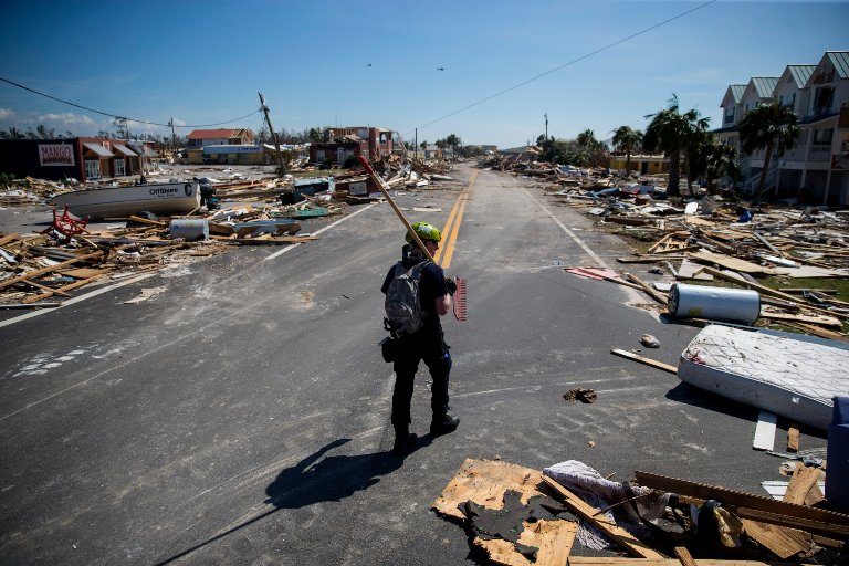 Click to enlarge A search-and-rescue worker walked down Main Street in Mexico Beach, Florida.