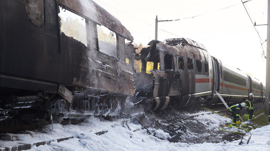 Click to enlarge Firefighters work on a Deutsche Bahn Inter City Express (ICE) train that caught fire on October 12, 2018 near Montabaur Germany