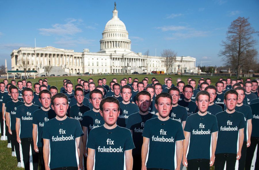 Click to enlarge Cardboard cutouts of Mark Zuckerberg