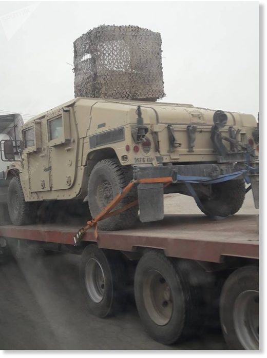 Click to enlarge Armored vehicles in Syria's Manbij.