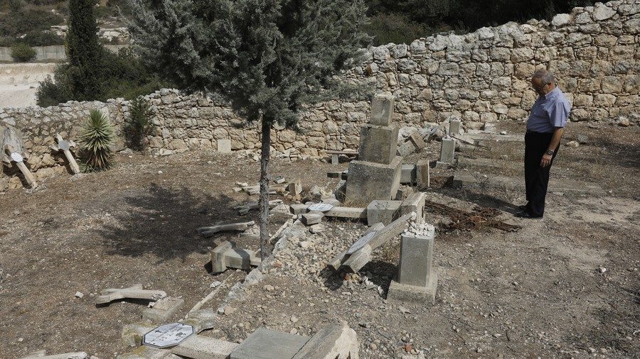 Click to enlarge Vandalized cemetery