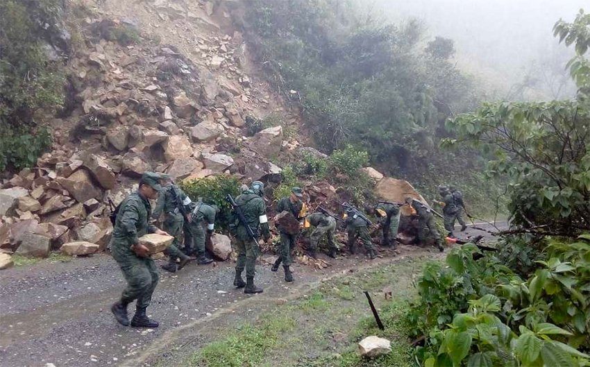 Soldiers clear a highway in Oaxaca.