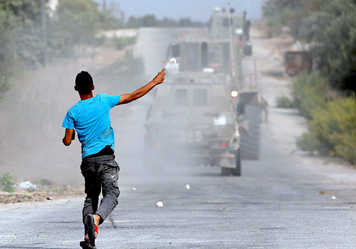 Palestinian guy stone military