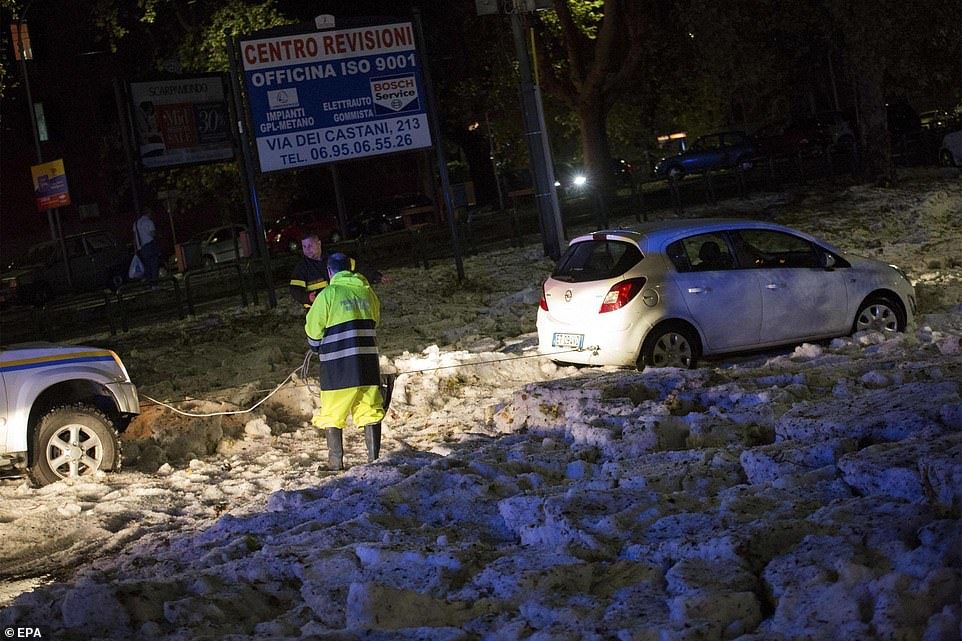 The weather blanketed streets with icy chunks and trapped many drivers in their cars in Rome's eastern neighbourhoods