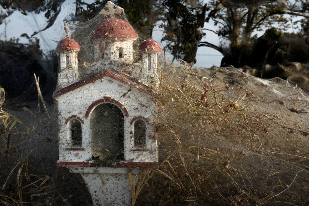 Spider webs cover a roadside shrine at the banks of Lake Vistonida, Greece, October 19, 2018.