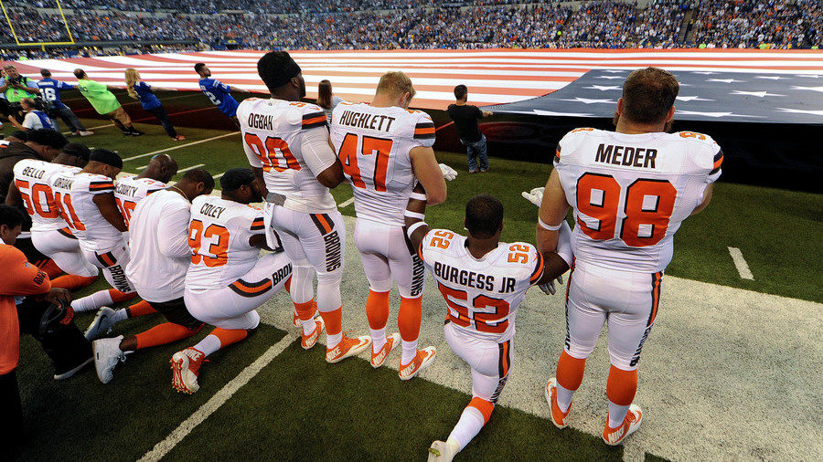 NFL players kneeling