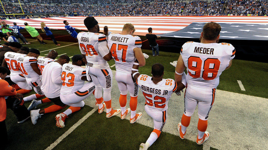 Click to enlarge NFL players kneeling