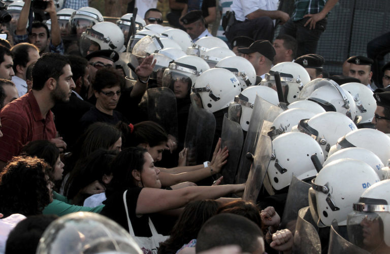 Click to enlarge Palestinian riot police clash protesters